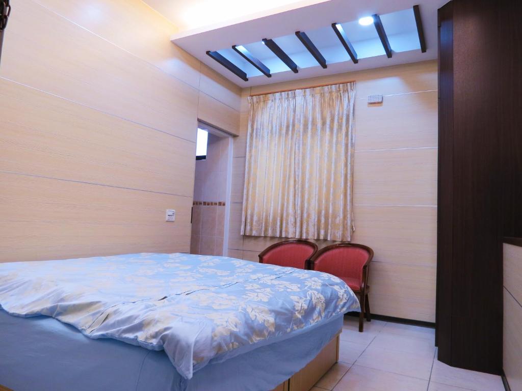 Postel nebo postele na pokoji v ubytování Lvyou B&B