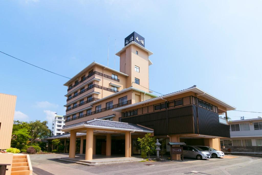 a building with a clock tower on top of it at Ureshino Motoyu in Ureshino