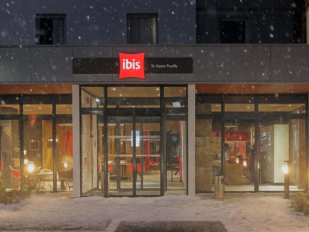 a store front with a ups sign in the snow at Ibis Saint-Genis-Pouilly Genève in Saint-Genis-Pouilly