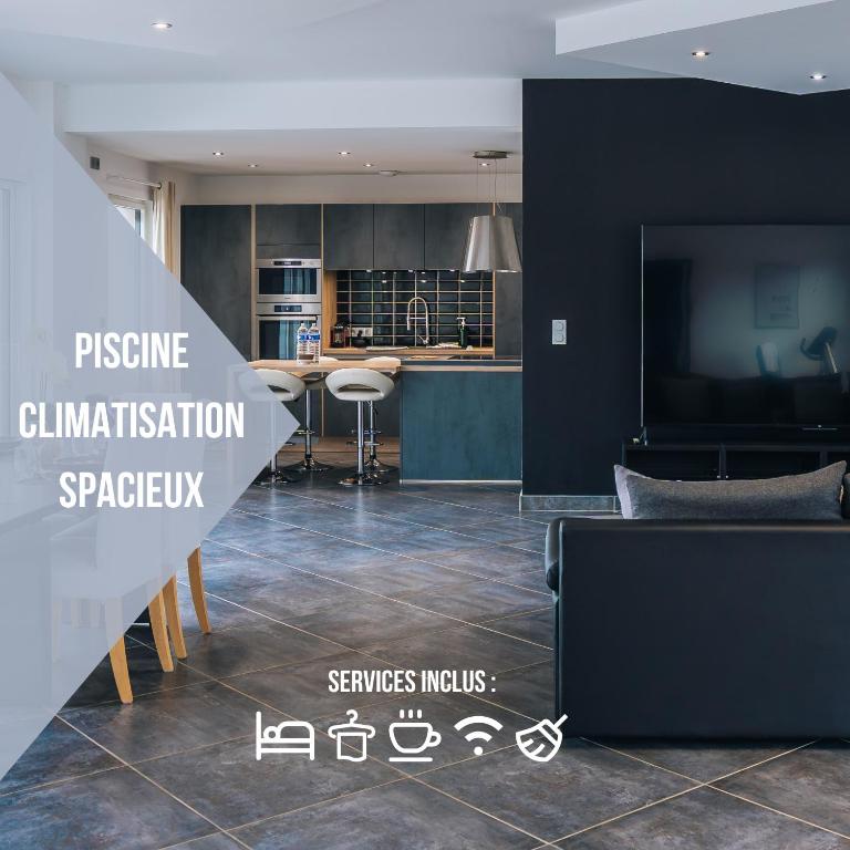 a view of a kitchen and a living room at La Villa Marais in Déols