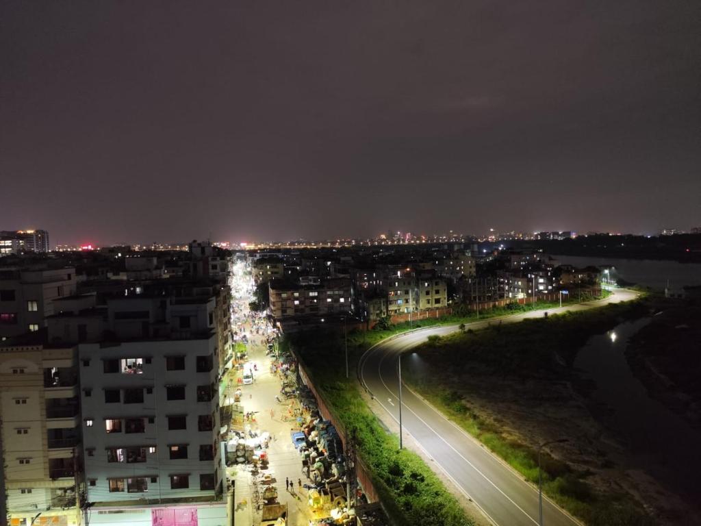 a view of a city at night with lights at Best Eastern Apartment in Dhaka