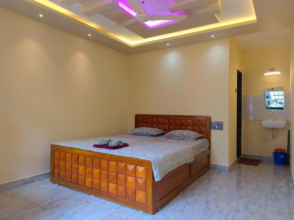 Ένα ή περισσότερα κρεβάτια σε δωμάτιο στο Vinayak Home Stay