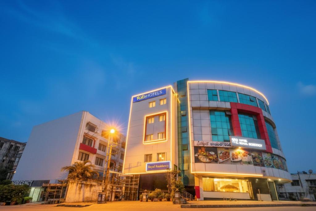 a building in the middle of a city at FabHotel Royal Residency II - Nr Lakdikapul Metro Station in Hyderabad