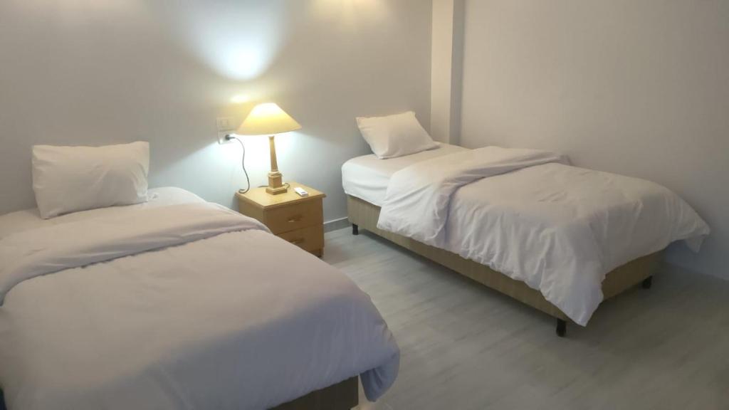 Voodi või voodid majutusasutuse Maat apartment toas