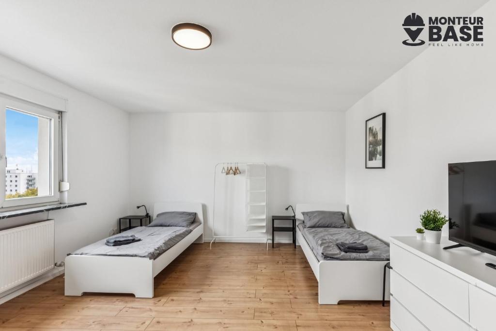 Ένα ή περισσότερα κρεβάτια σε δωμάτιο στο MONTEUR - Unterkunft für bis zu 5 Personen in 63454 Hanau - HU12