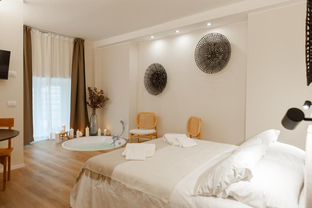 Ένα ή περισσότερα κρεβάτια σε δωμάτιο στο Wellness Suites