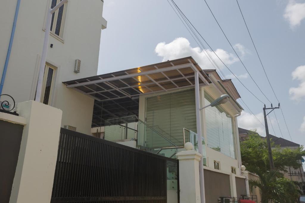 a house with awning on the side of it at Ark Villa Hotel & Spa in Lekki