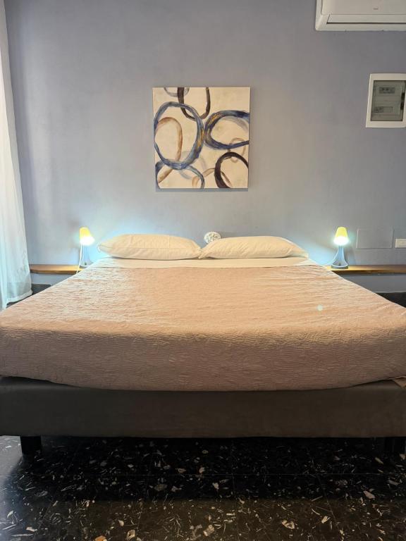 Ένα ή περισσότερα κρεβάτια σε δωμάτιο στο Holidays Rooms Rattazzi