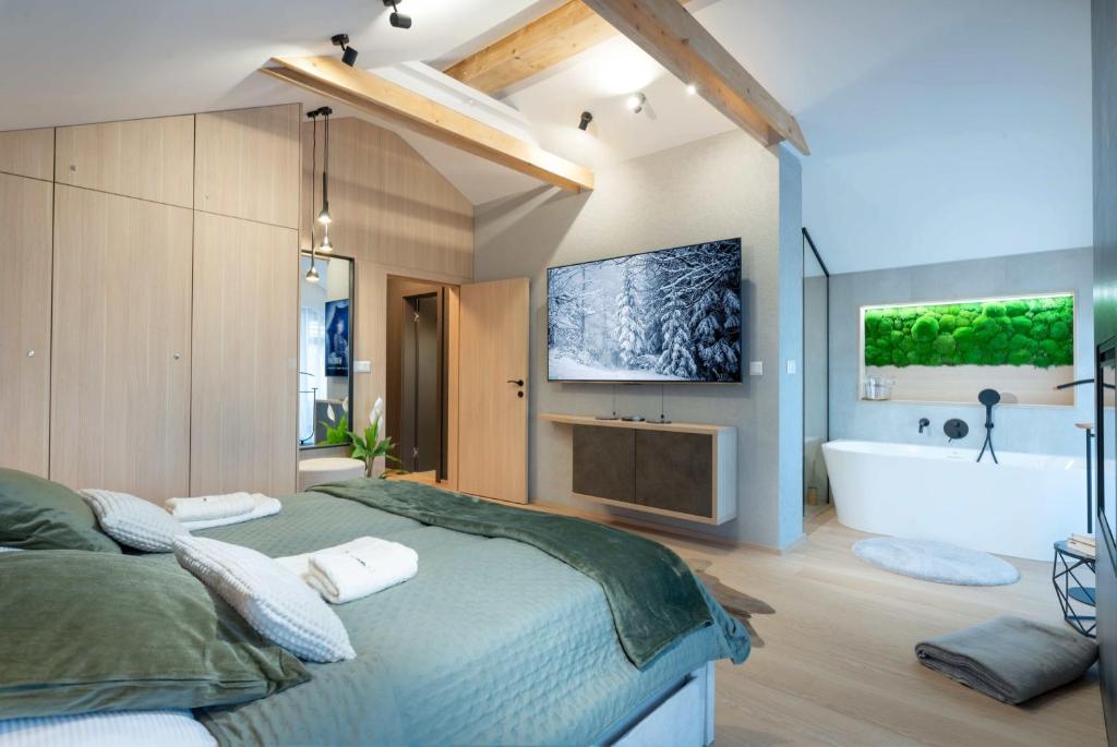 Postel nebo postele na pokoji v ubytování Apartmanica Chalet 5B private wellness, garage, Donovaly