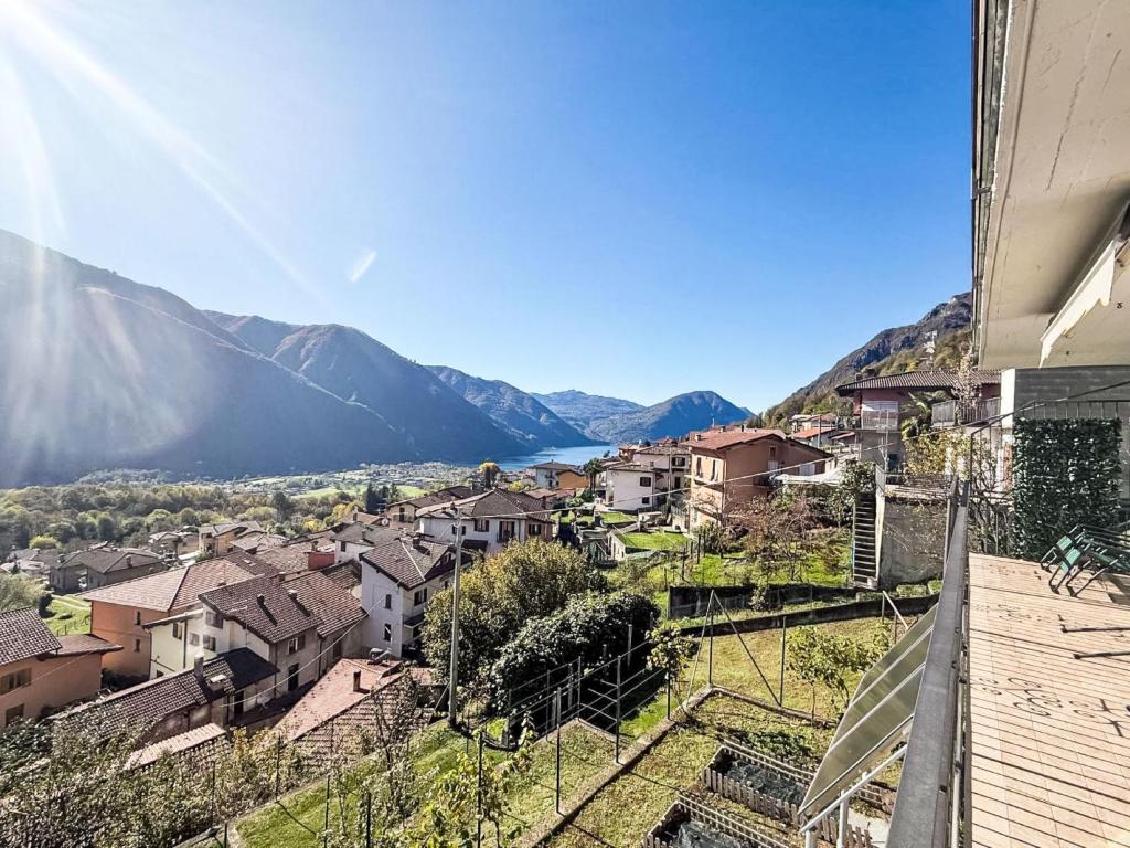 a view of a town with mountains in the background at Apartment Bellavista by Interhome in Porlezza