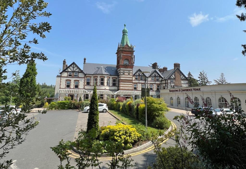 a large building with a clock tower on top of it at The Lucan Spa Hotel in Lucan