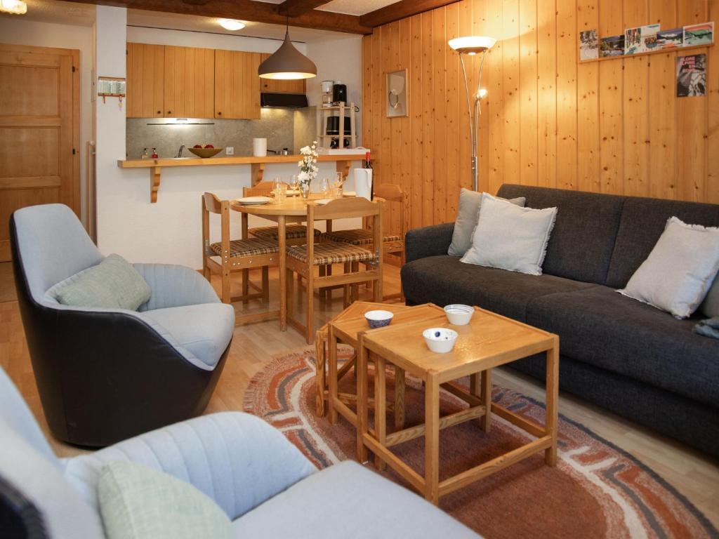 a living room with a couch and chairs and a table at Apartment Parc C013 by Interhome in Champex