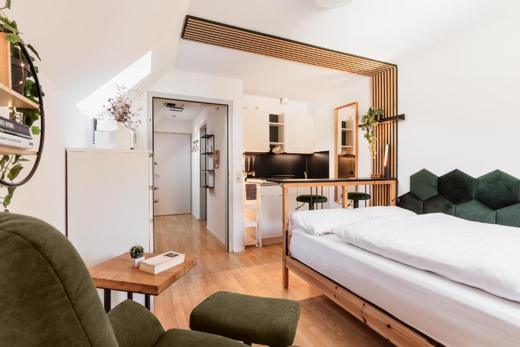 a bedroom with a bed and a living room at Hike & Ski-in Ski-out Mountain View Apartment for Family & Friends in Hinterstoder