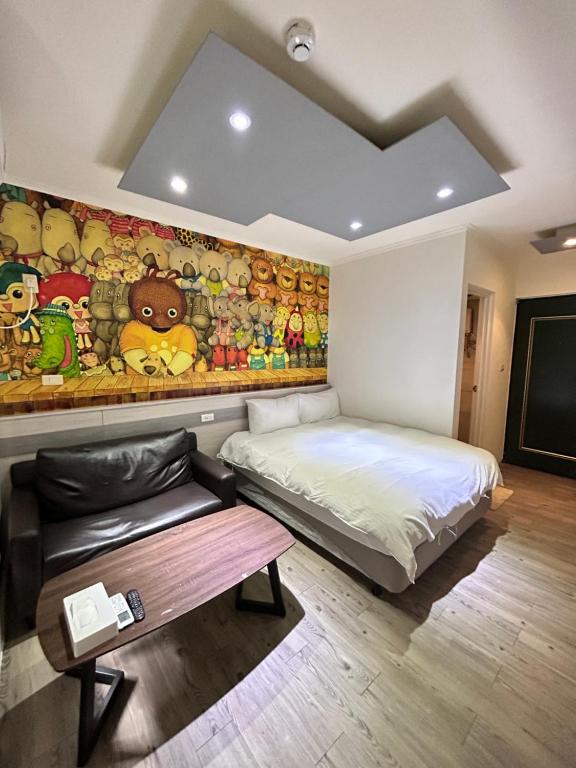 a bedroom with a bed and a wall of stuffed animals at 逢甲Cartoon in Hsia-shih-pi