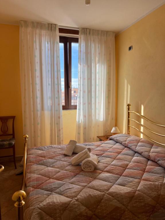 Postel nebo postele na pokoji v ubytování Affittacamere Cappuccini