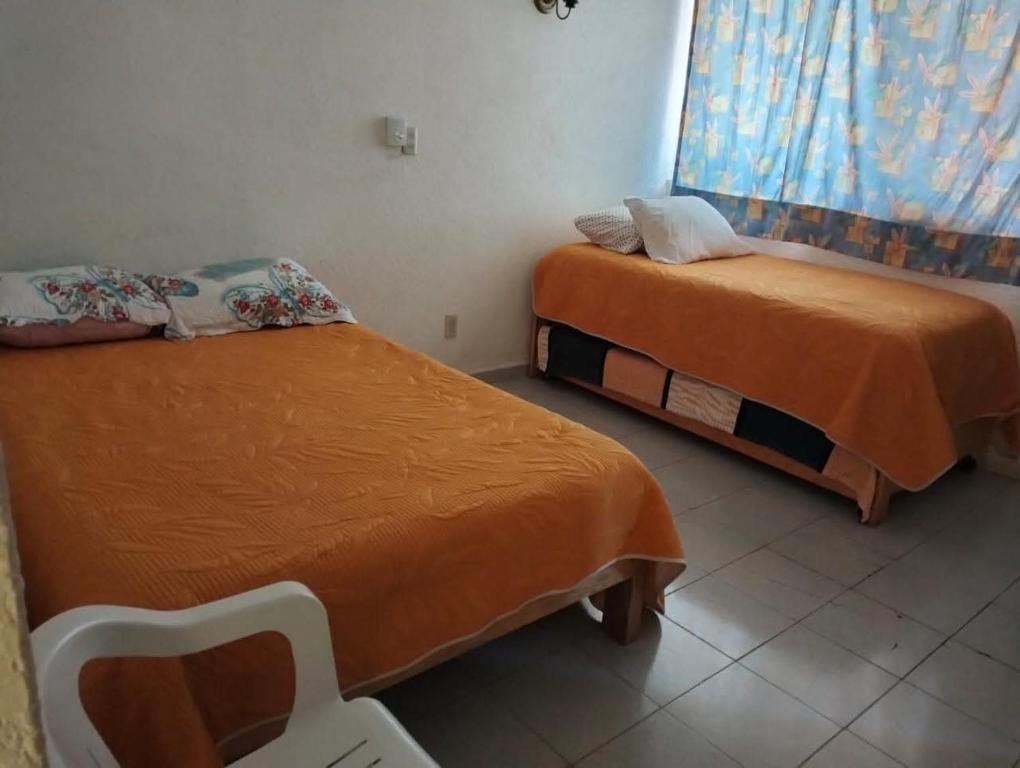 Postel nebo postele na pokoji v ubytování Casa Mixtecos habitación 1