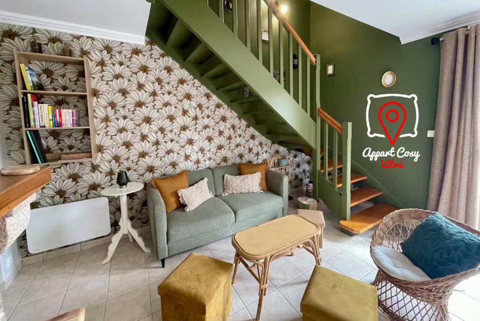 a living room with a couch and a book shelf at AppartCosy 20 Maison proche "La Régalante" in Landavran