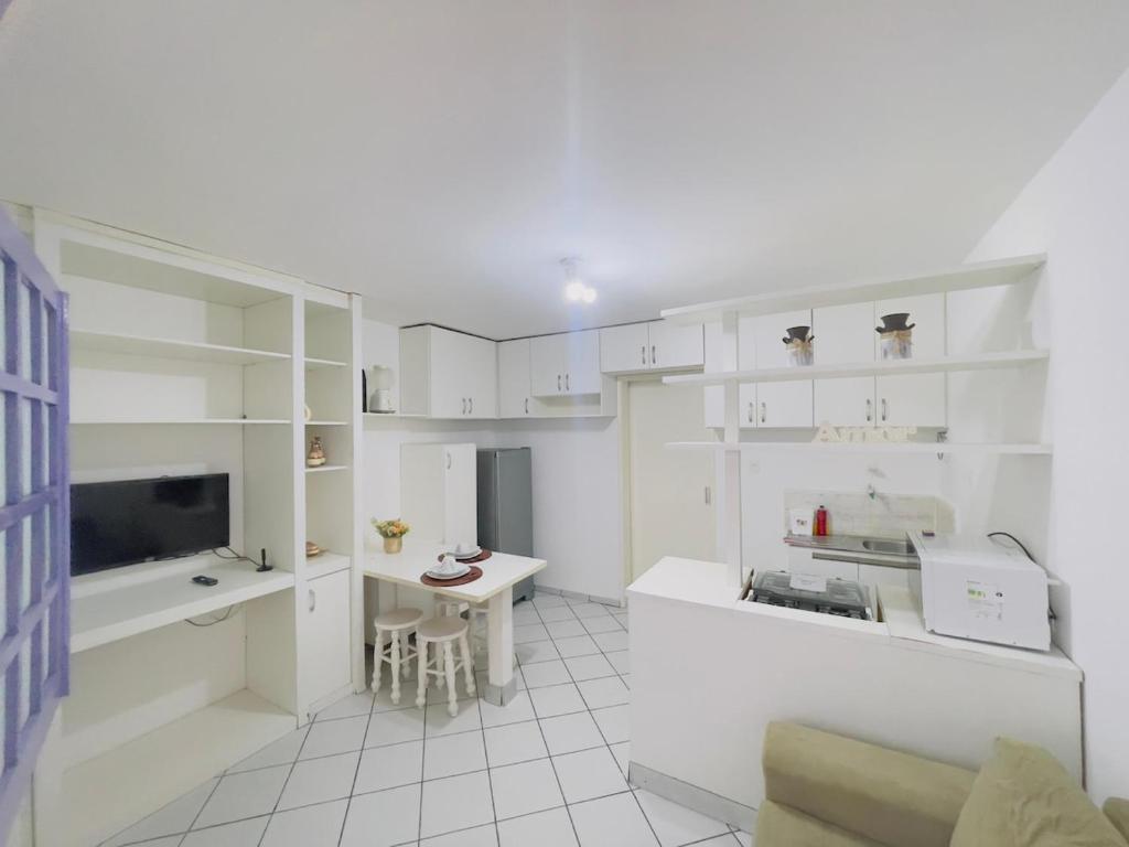 Η κουζίνα ή μικρή κουζίνα στο Downton · Loft | 1/4 Aconchegante com Ar e Garagem