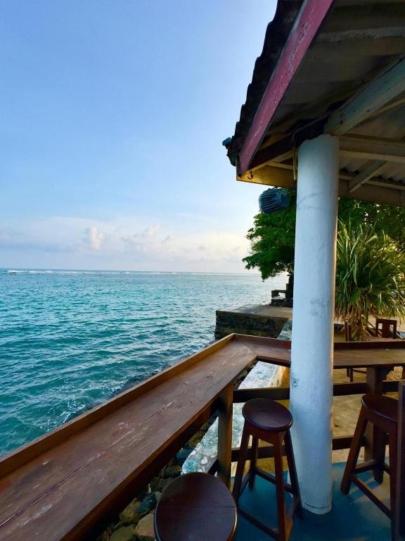 a view of the ocean from the porch of a resort at Royal Sea Wind in Matara