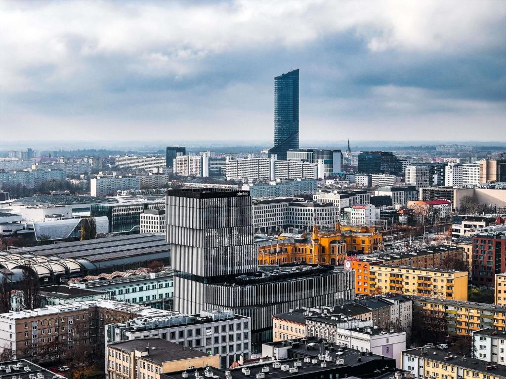 an aerial view of a city with a tall skyscraper at Ibis Styles Wroclaw Centrum in Wrocław