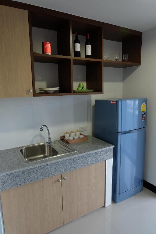 Kuchyň nebo kuchyňský kout v ubytování Wisdom Residence