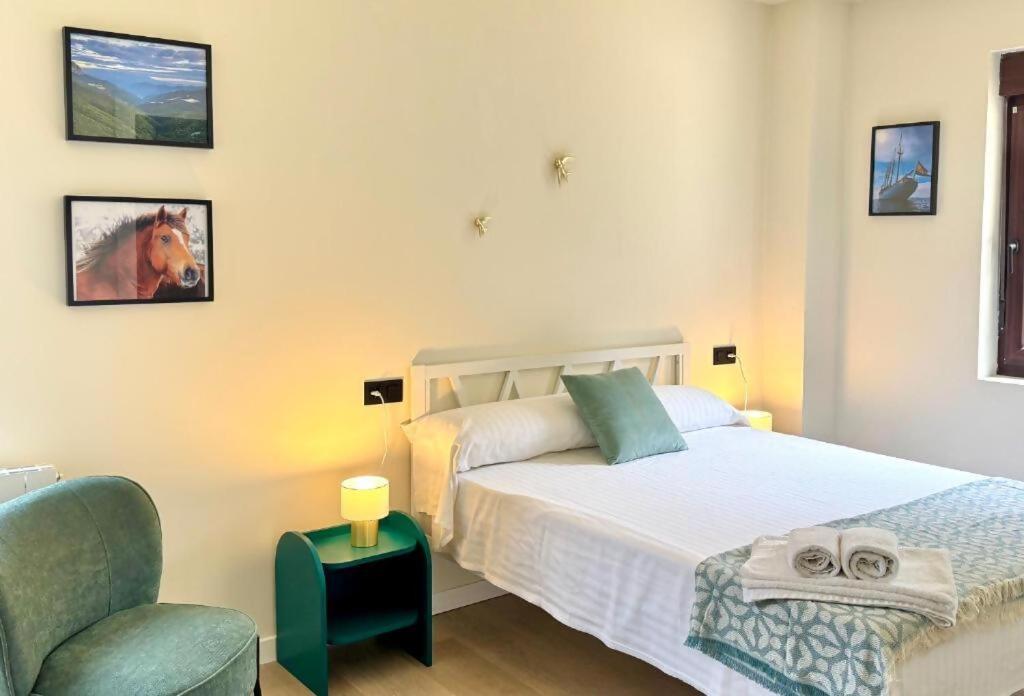 Ένα ή περισσότερα κρεβάτια σε δωμάτιο στο Villa Olas y Llamas Ciudad, mar y naturaleza