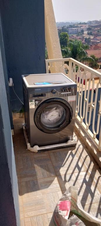 a tv sitting on a porch on a house at CHS Vacation Stays Limited in Kampala