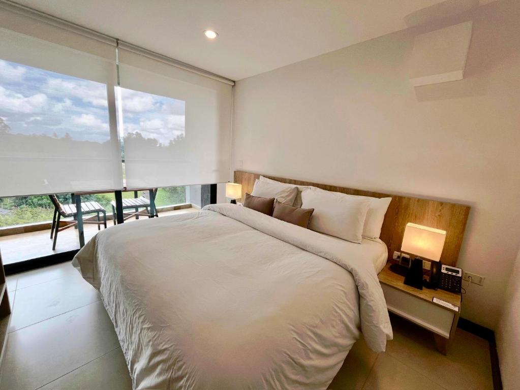 Una cama o camas en una habitación de Hotel Rioverde - Habitación Estándar