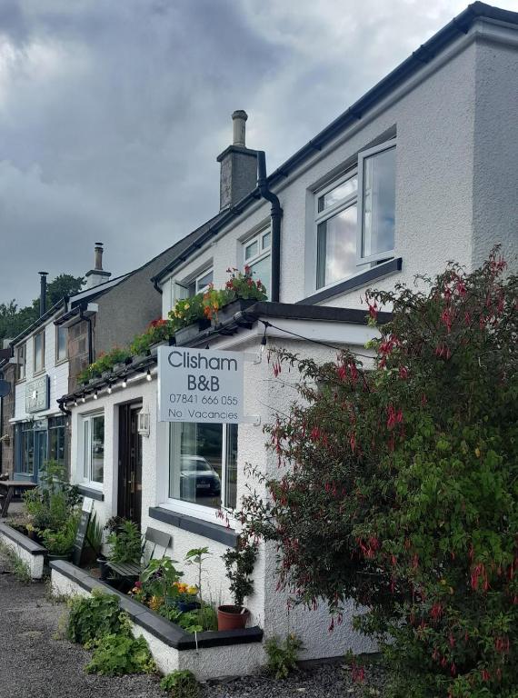 a building with a sign that reads citizen brogue at Clisham Bed and Breakfast in Lochcarron