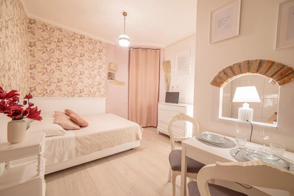 Ένα ή περισσότερα κρεβάτια σε δωμάτιο στο La Stanza del Poeta