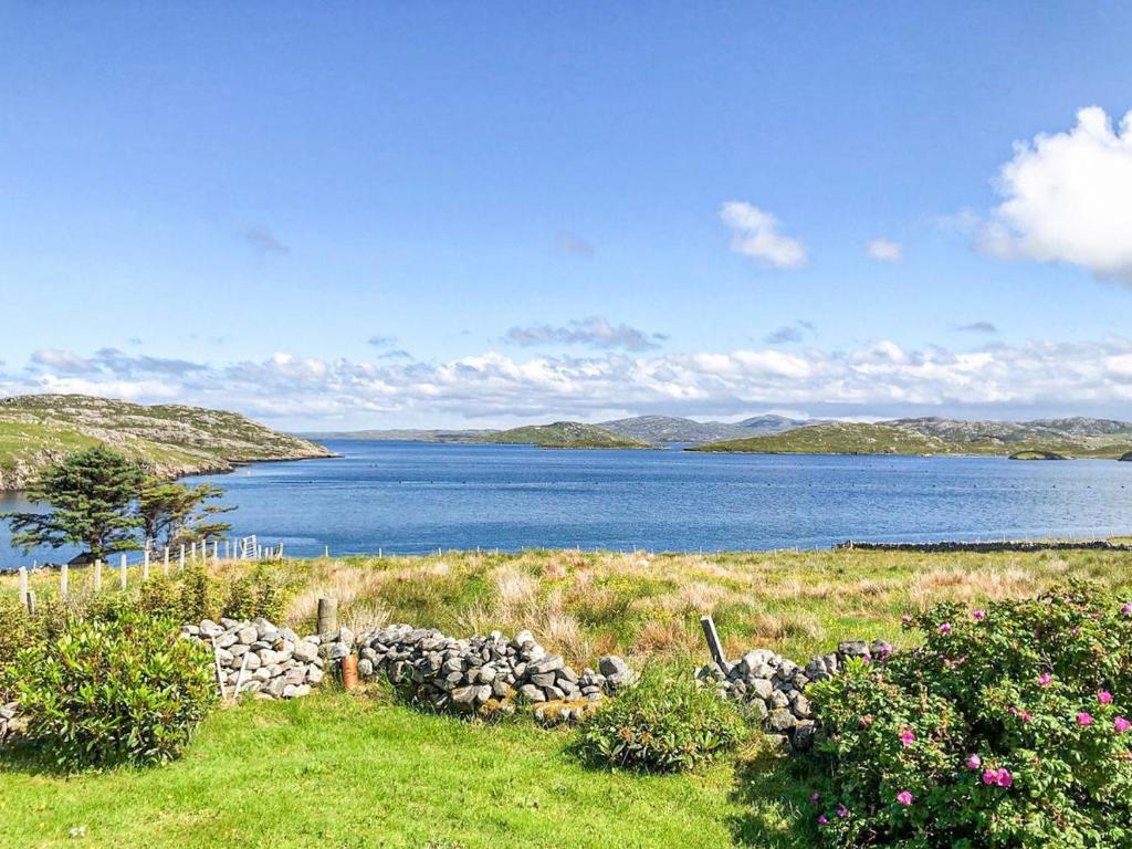 a view of a large body of water with mountains at Taigh Na Beadan in Valtos