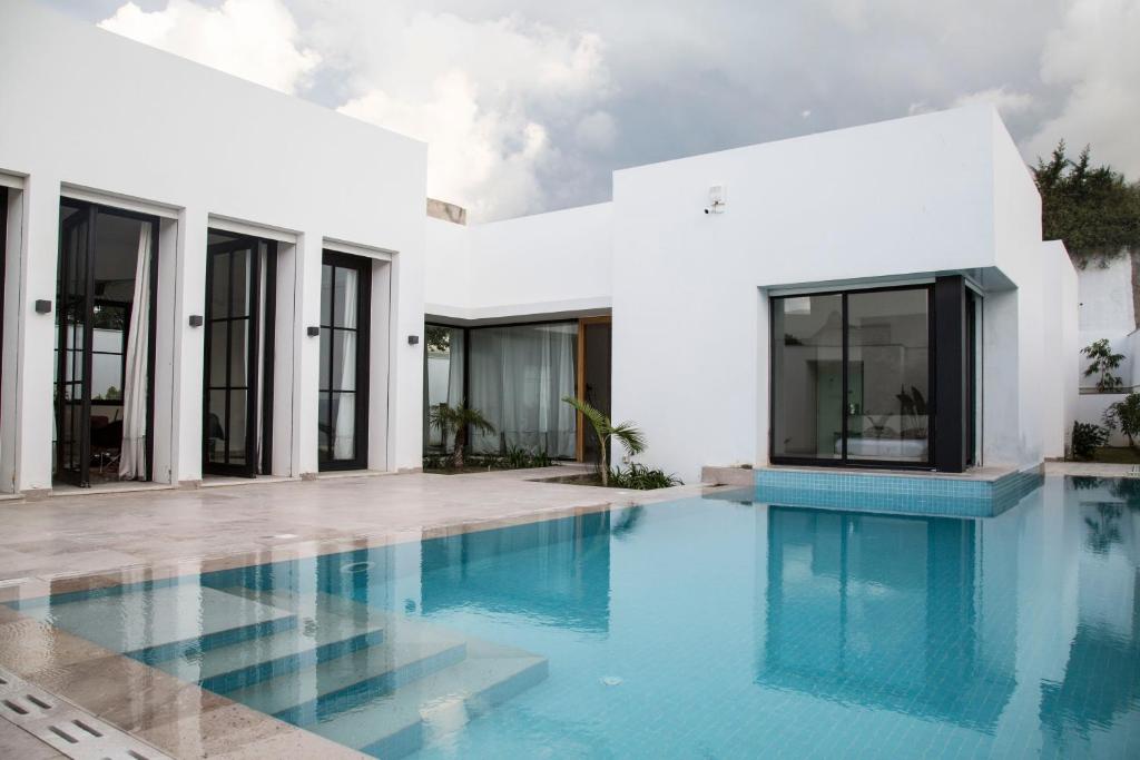 Πισίνα στο ή κοντά στο Les Verrières De Gammarth Piscine et confort