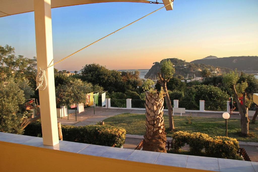 a view from the balcony of a house with a palm tree at Belvedere in Procida