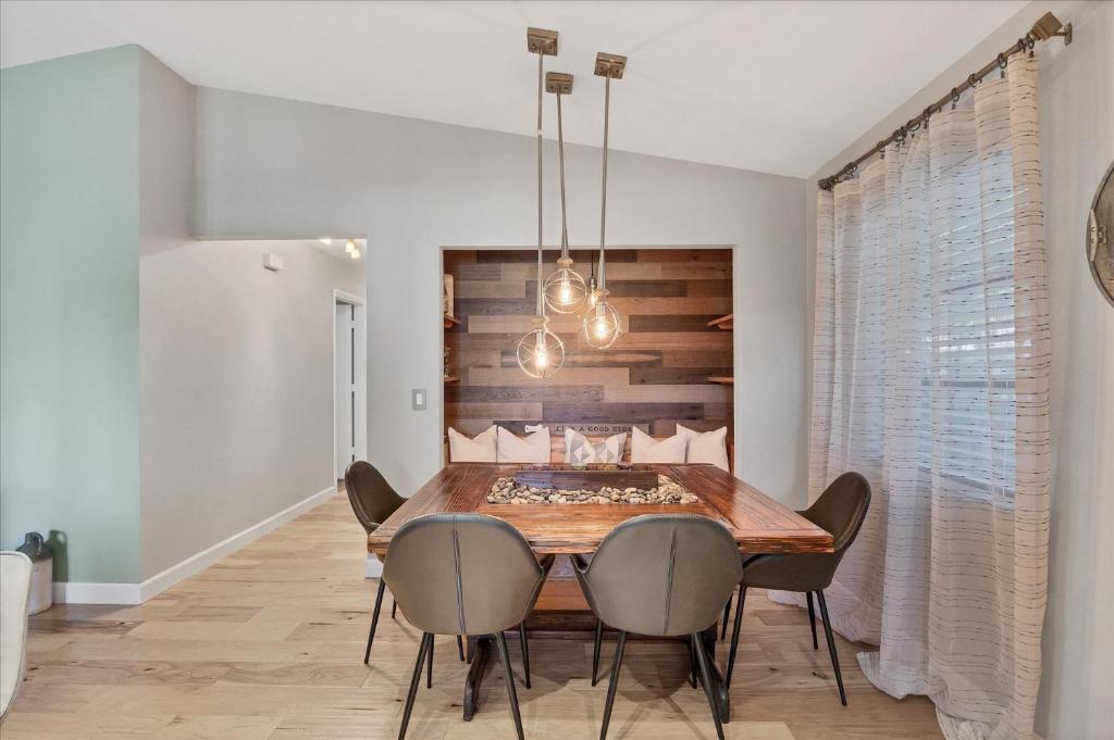a dining room with a wooden table and chairs at 227 Goldstein in Punta Gorda