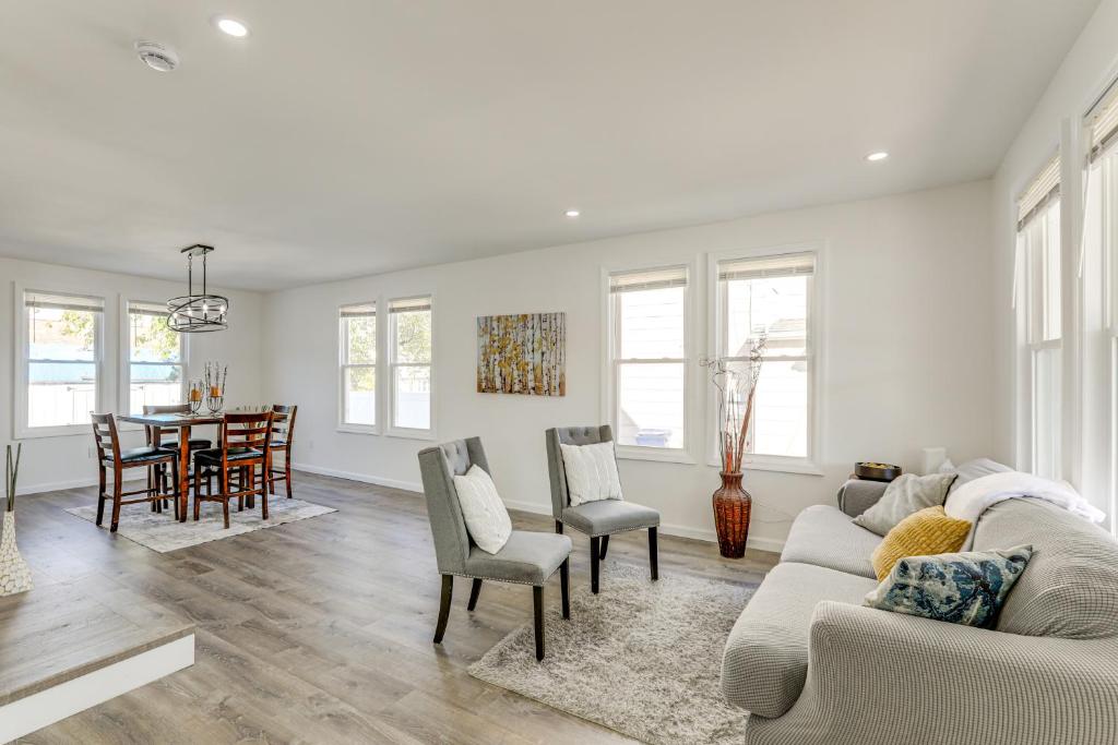 a living room with a couch and a table at 10 Mi to Lincoln Financial Field Family Home! in Colonial Manor
