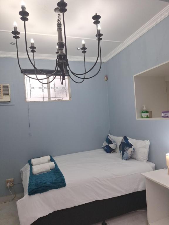 Postel nebo postele na pokoji v ubytování Oban Guesthouse Durban