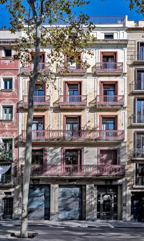 a large building with balconies on the side of it at Aparthotel Rambla108 in Barcelona