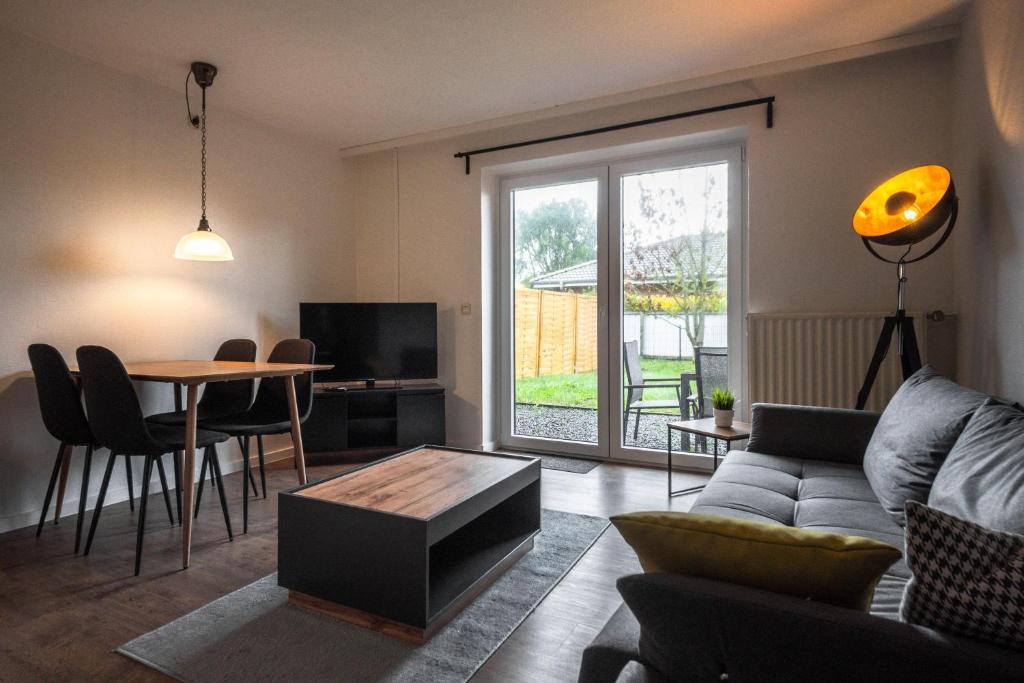 a living room with a couch and a table at Deichkoje 1 Dagebüll in Dagebüll