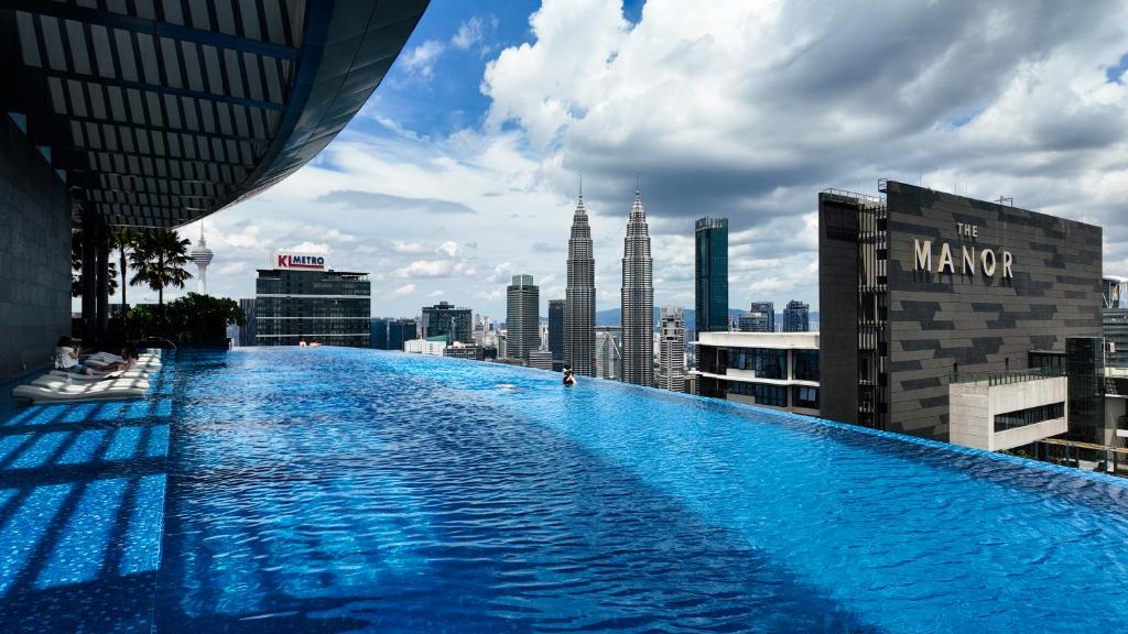 a large swimming pool on the roof of a building at Eaton Residence Kuala Lumpur - M Home in Kuala Lumpur