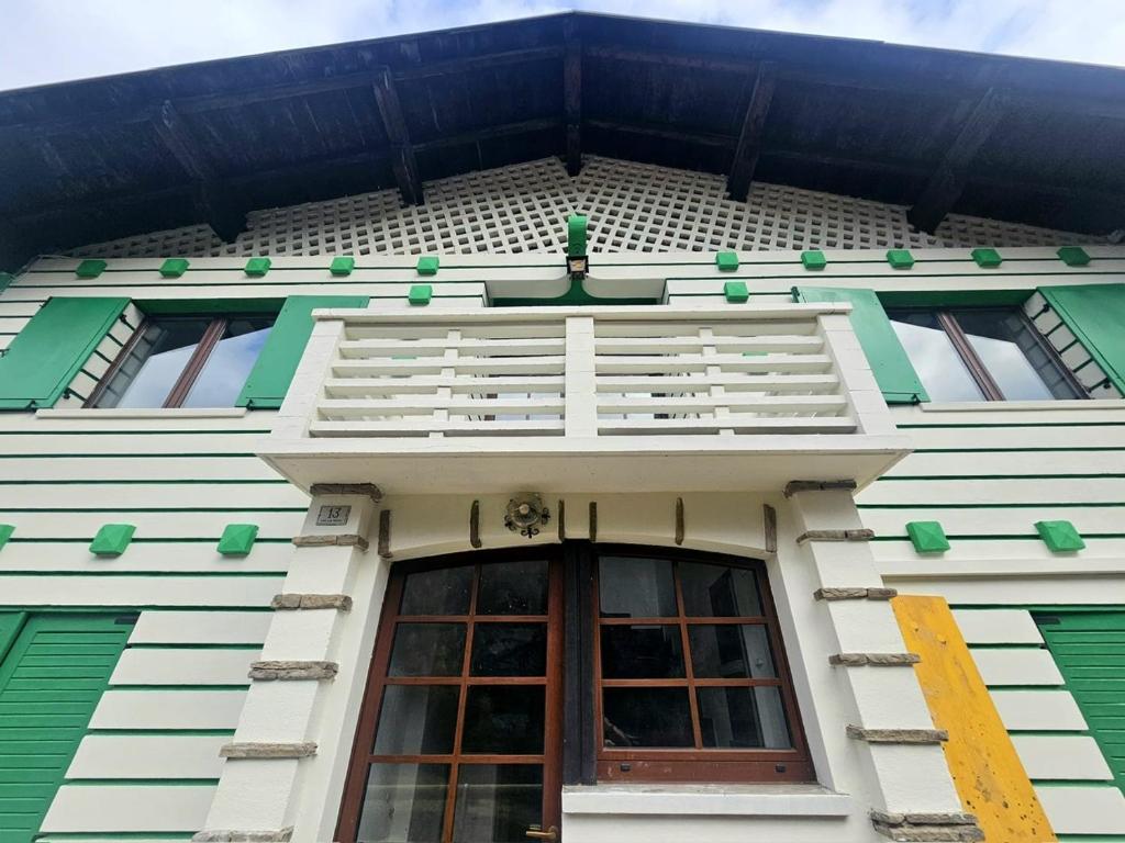 a building with a window and a balcony at Rifugio TEA Dolomiti in Caviola