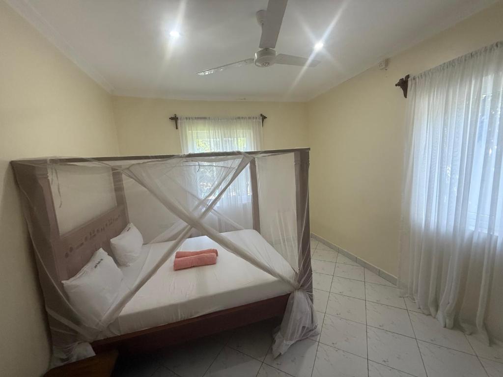 Ένα ή περισσότερα κρεβάτια σε δωμάτιο στο Langai Villa