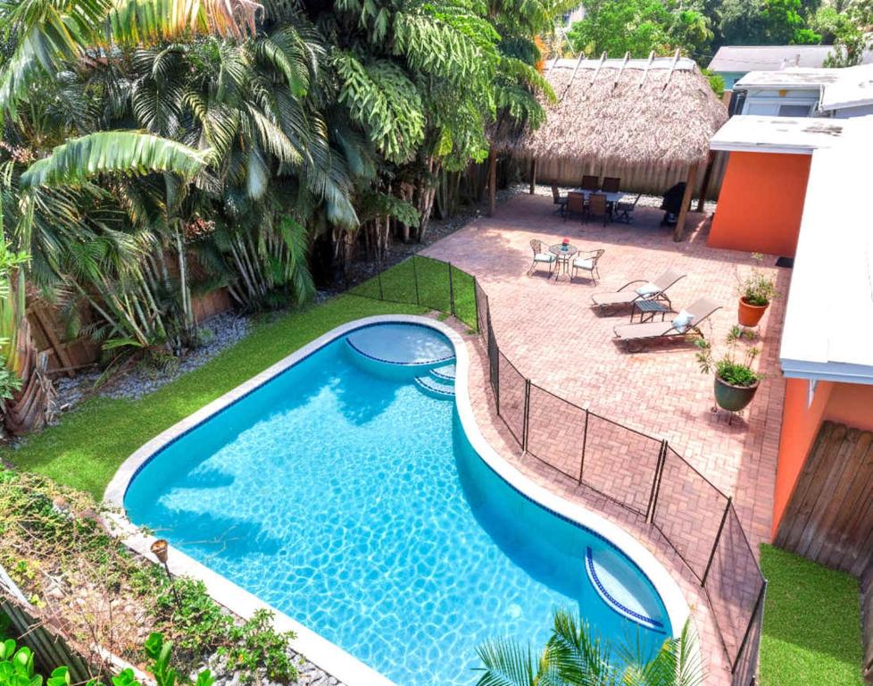 an overhead view of a swimming pool in a backyard at Hidden Gem Vacation Villa w Private Pool & TikiHut in Fort Lauderdale