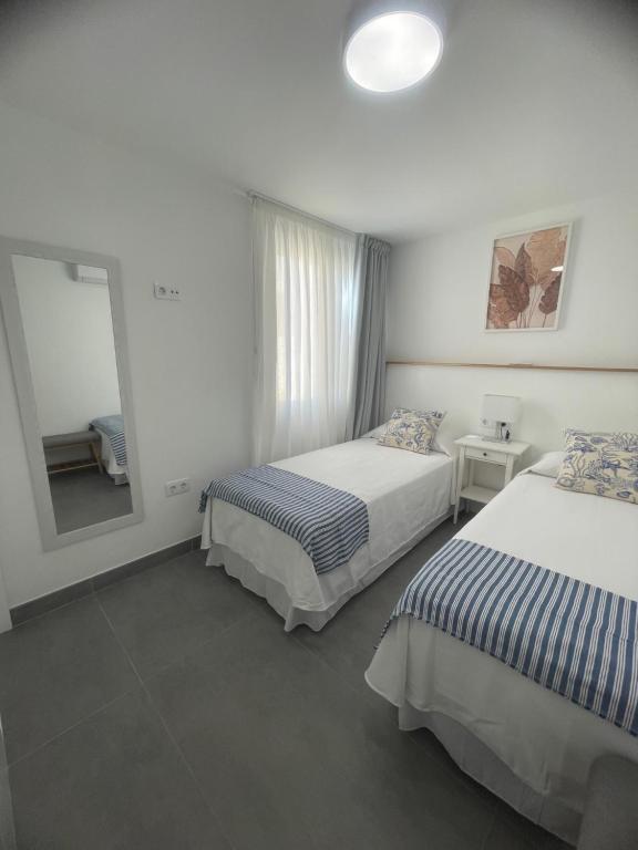 Postel nebo postele na pokoji v ubytování IPA Palm Garden