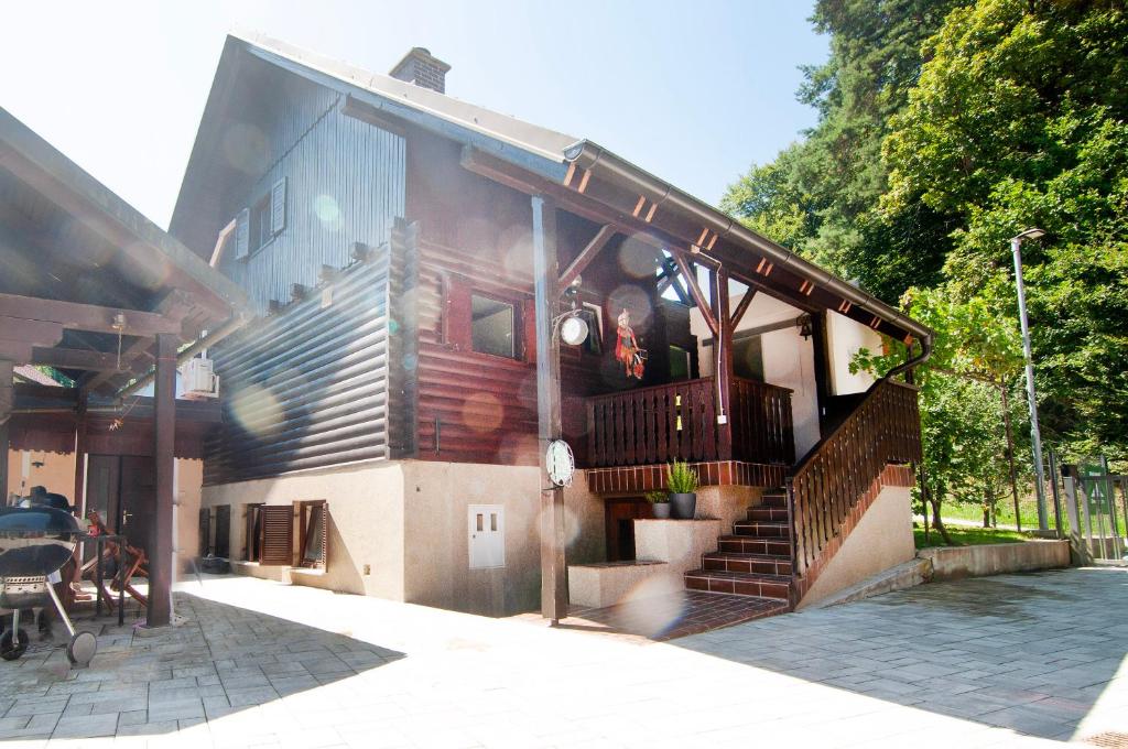 a house with a staircase on the side of it at Grunthouse in Prebold