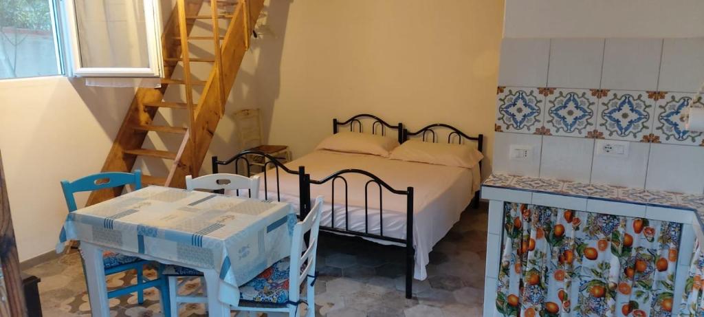 Ένα ή περισσότερα κρεβάτια σε δωμάτιο στο A Bugatta