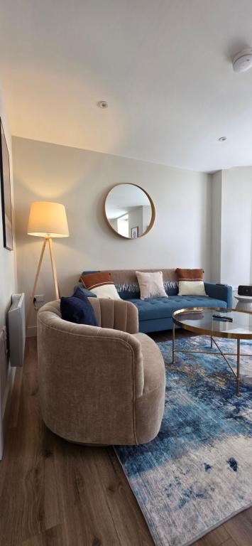 a living room with a couch and a table at Turtle Cove in Portrush