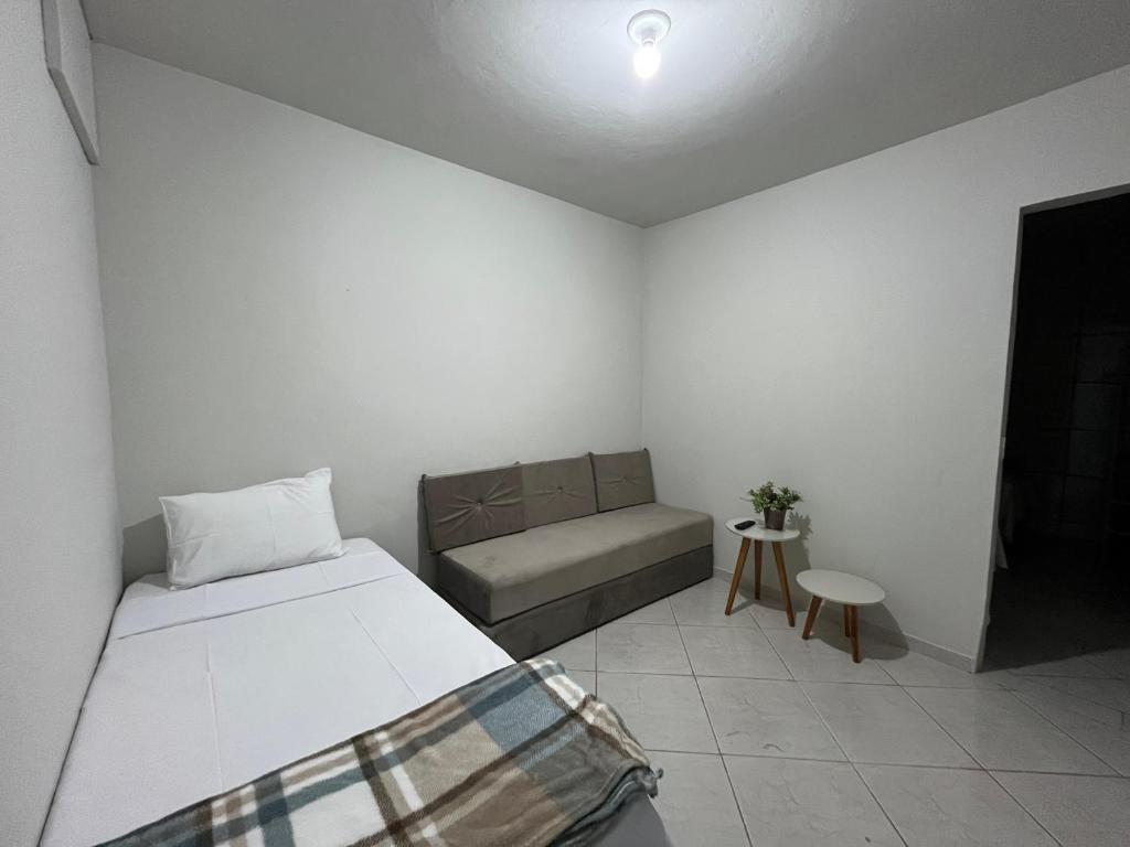 Ένα ή περισσότερα κρεβάτια σε δωμάτιο στο Recanto Canuto D