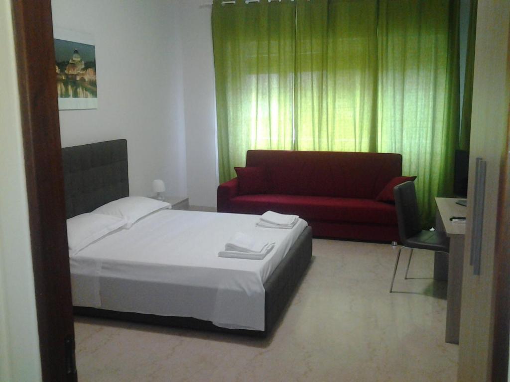 Posteľ alebo postele v izbe v ubytovaní Olimpica Relais guest house