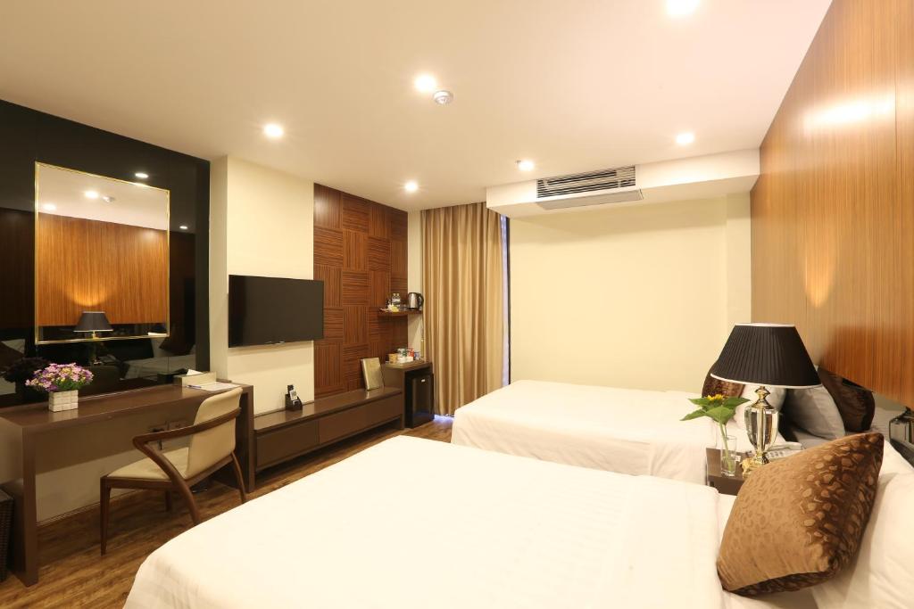 Postel nebo postele na pokoji v ubytování Au Viet Hotel