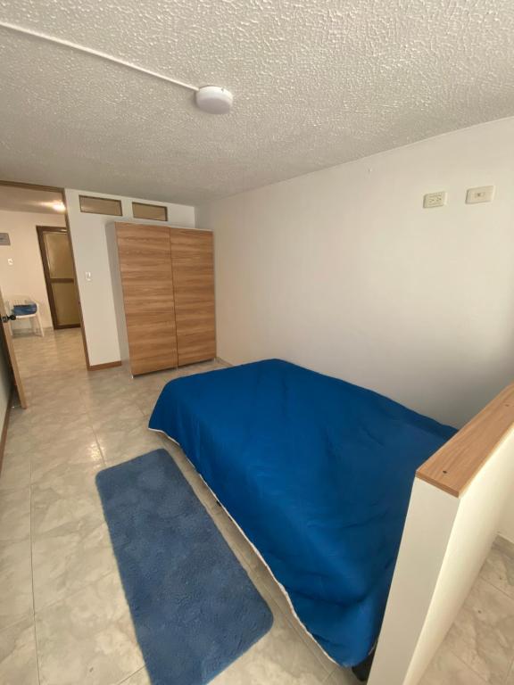 Ένα ή περισσότερα κρεβάτια σε δωμάτιο στο Apartamento 202 frente a UPTC